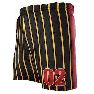 May include: Black athletic shorts with vertical gold stripes and a solid burgundy panel on the right side. The number "02" is displayed in burgundy on the lower right leg. The shorts have a black waistband.