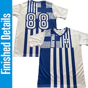 May include: Two white and blue soccer jerseys. One jersey has the number "88" in white on the back. The other jersey has the word "FINLAND" and a cross emblem. Both jerseys have a blue and white striped design.