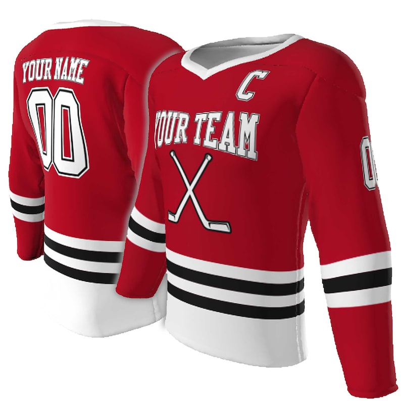 May include: A red hockey jersey featuring white and black horizontal stripes at the hem and sleeves. The front displays the text YOUR TEAM, a letter C, and crossed hockey sticks. The back shows the text YOUR NAME and the number 00 in white.