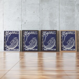 May include: Four framed prints with a blue background and a white whale design. The prints have the text "Save the Whales" in white and Japanese text in black. The text "Берегите Китов" is also in white.