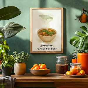 May include: A framed print of Jamaican Pepper Pot Soup hangs on a teal wall. The artwork depicts a bowl of soup with steam rising, above the text "Jamaican Pepper Pot Soup". The scene includes plants, a bowl of oranges, and jars.