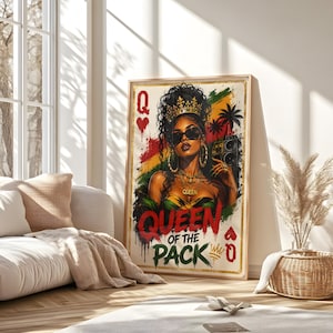 May include: Framed art print featuring a woman with sunglasses, a crown, and gold jewelry. The artwork has a red, yellow, and green background with the words "QUEEN OF THE PACK" in red and gold. The print is in a wooden frame.