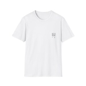 May include: A white short-sleeved t-shirt with a crew neck. The shirt has the word "LEJI" printed in black on the upper right chest area. The shirt is made of a soft, comfortable material.