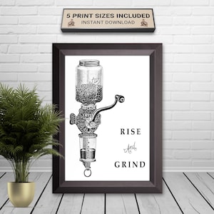 May include: Framed black and white print of a vintage coffee grinder. The print features the words "RISE" and "GRIND" in a decorative font. A small sign above the frame reads "5 PRINT SIZES INCLUDED INSTANT DOWNLOAD".