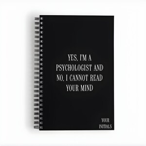 May include: Black spiral bound notebook with the text "YES, I'M A PSYCHOLOGIST AND NO, I CANNOT READ YOUR MIND" in white. The bottom of the notebook says "YOUR INITIALS".