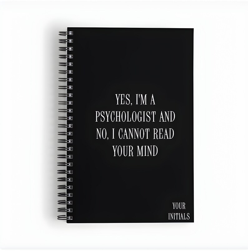 May include: Black spiral bound notebook with the text "YES, I'M A PSYCHOLOGIST AND NO, I CANNOT READ YOUR MIND" in white. The bottom of the notebook says "YOUR INITIALS".