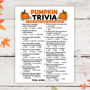 May include: A white paper sheet featuring a Pumpkin Trivia game with orange pumpkin illustrations at the top. The text includes twenty multiple-choice questions about pumpkins, with a total score line at the bottom. The design is themed for autumn.