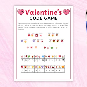 Peut inclure: Un jeu de code sur le thème de la Saint-Valentin sur papier blanc avec une bordure rose. Le jeu comprend des emojis et un code pour décoder un message secret. Un stylo bleu est sur le côté droit de l'image.