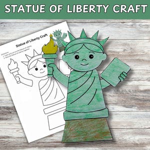 May include: A green and brown Statue of Liberty craft, holding a torch and a tablet, next to a black and white outline of the same craft. The words "Statue of Liberty Craft" are at the top of the image.