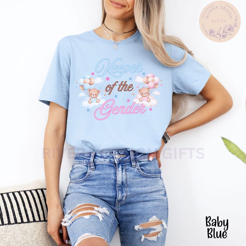 May include: A light blue t-shirt with the text "Keeper of the Gender" in pink and blue lettering. Two teddy bears are holding pink and blue balloons, floating above clouds with stars.