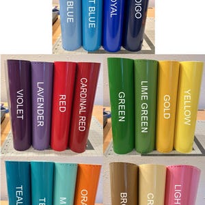 Puede incluir: Una colecci&oacute;n de rollos cil&iacute;ndricos de material liso y de color s&oacute;lido dispuestos en filas. Cada rollo presenta una etiqueta de color distinta que incluye Ice Blue, Light Blue, Royal, Indigo, Violet, Lavender, Red, Cardinal Red, Green, Lime Green, Gold, Yellow, Teal Blue, Teal, Mint, Orange, Brown, Cream y Light Pink.
