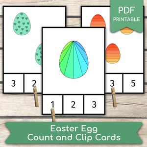 May include: Printable Easter egg count and clip cards.  Three cards feature different colored eggs with numbers 1, 2, 3, 5.  The cards are black and white with a green border.