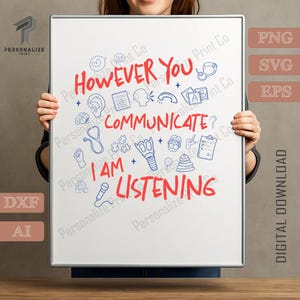 May include: A white framed print with the text "HOWEVER YOU COMMUNICATE? I AM LISTENING" in red and black. The print is held by a person and features various blue and red doodle illustrations.