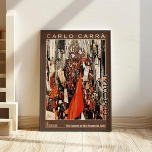 May include: A framed art print of Carlo Carrà's "The Funeral of the Anarchist Galli" from 1910-1911. The artwork features a chaotic scene with red flags and figures, in a Cubist style. The print is in a dark brown frame.