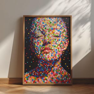 May include: A framed wall art print featuring a portrait of a face composed entirely of multicolored circular dots against a solid black background. The dots are arranged in various sizes and hues, creating the facial features and neck area.