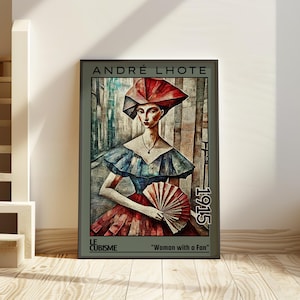 May include: Framed art print of a cubist painting titled "Woman with a Fan" by André Lhote, 1915. The artwork features a woman in a red and blue dress holding a fan. The print is in a dark grey frame.