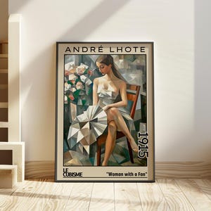 May include: Framed art print of a cubist painting by André Lhote, titled "Woman with a Fan" from 1915. The artwork depicts a woman seated, holding a fan, with a geometric background and floral elements. The frame is black.