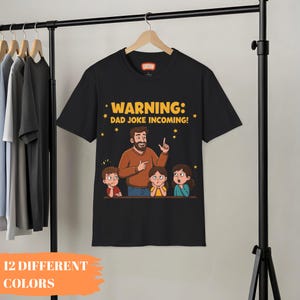 面白いお父さんのジョークTシャツ、お父さんのジョークの到来を警告、陽気な父の日ギフトTシャツ、漫画のユーモアシャツ、家族が笑う服装、お父さんの陽気さ