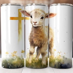 May include: A white stainless steel tumbler with a watercolor design of a lamb standing in a field of grass with a gold cross behind it.