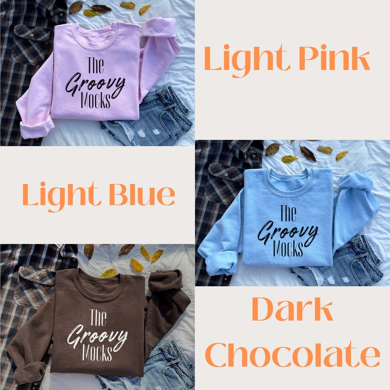 May include: Three sweatshirts in different colours: light pink, light blue, and dark chocolate. Each sweatshirt has the text "The Groovy Mocks" printed on the front.