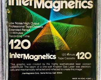 May include: A black and white image of a 120 minute audio cassette tape. The image is a graphic created by a laser and features the text "InterMagnetics" and "120 Minute Tape Cassette".