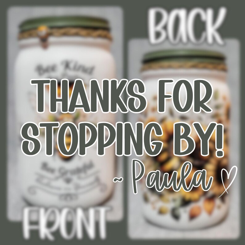 May include: Two white mason jars with green lids. The front jar has the text "Be Kind" and "Be Grateful" on it. The back jar has a floral design. The text "THANKS FOR STOPPING BY! ~ Paula" is superimposed on the image.