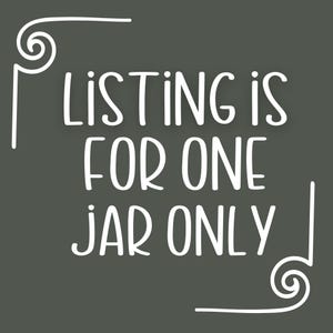 May include: White text on a dark gray background reads "Listing is for one jar only" with decorative swirls at the top and bottom of the text.