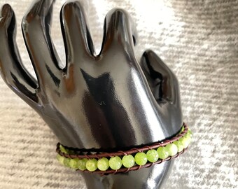 Leather and peridot bracelet. Peridot is said to improve health, promote restful sleep.  Can be made to order for lengths longer or shorter