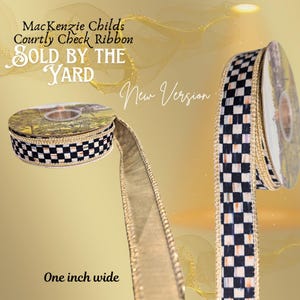 May include: A spool of Courtly Check ribbon, one inch wide, with a black and white checkered pattern and gold trim. The ribbon is labeled "MacKenzie Childs Courtly Check Ribbon". The ribbon is sold by the yard.