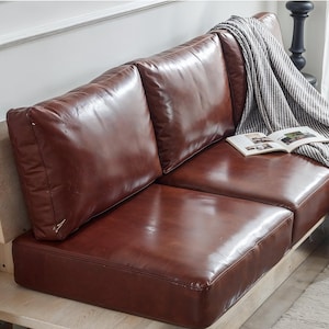 Reddish brown faux leather cushions, faux leather cushion covers, customized sizes, wipeable with water.