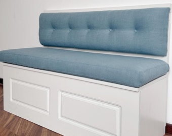 May include: A white bench with a blue upholstered seat and back. The back has four button tufts.