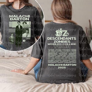May include: Charcoal grey t-shirt with the text "MALACHI BARTON" and images of a person. The back of the shirt shows "DESCENDANTS ZOMBIES WORLDS COLLIDE TOUR" with a list of cities and "MALACHI BARTON 2025".