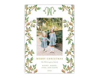 May include: Christmas card featuring a family photo framed by a floral border. The card includes the text "Merry Christmas" and the family name. The photo shows two young girls in dresses.