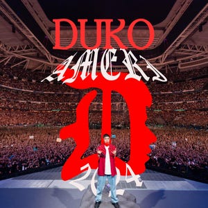May include: A person wearing a red jacket and blue jeans stands on a stage in front of a large crowd. The stage is decorated with a large red letter "D" and the words "DUKO AMERI 2024" in red and white.