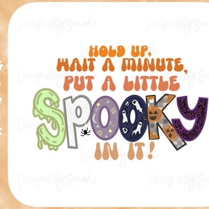May include: A colorful graphic design with the text "Hold up, wait a minute, put a little spooky in it!" The text is in a retro style with a green, purple, and orange color scheme. The letters are decorated with Halloween-themed images like ghosts, pumpkins, and spiders.