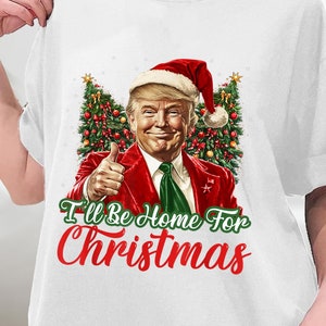 クリスマスには家に帰ります おもしろサンタクロース トランプ 2024 Tシャツ、クリスマスサンタトランプシャツ、トランプクリスマスシャツ、スウェットシャツ、パーカー