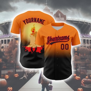 May include: Orange and black baseball jersey with the text "Yourteams" and the number "00". The back of the jersey features a candle design with the text "YOURNAME". The jersey has a button-down front and short sleeves. The background includes a spooky Halloween scene.