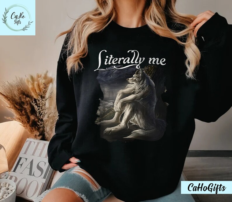 May include: Black sweatshirt with a white wolf graphic and the text "literally me" printed on the front.