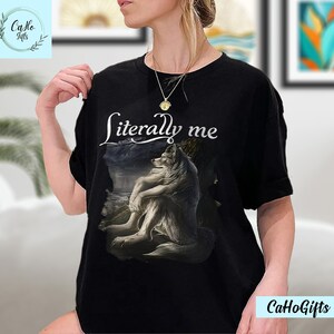 May include: Black t-shirt with a white wolf graphic and the text "literally me".