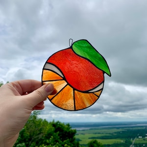 Orange stained glass suncatcher