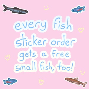 May include: Pink background with blue text that reads "every fish sticker order gets a free small fish, too!" There are several small fish illustrations in blue, red, and brown.