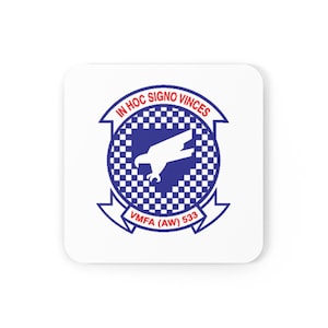 May include: A white square coaster with a blue and white checkered circle in the center. The circle contains a white silhouette of a bird in flight. The text "IN HOC SIGNO VINCES" is written in red around the circle. Below the circle is a white banner with the text "VMFA (AW) 533" in red.