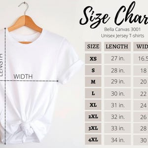 May include: A white Bella Canvas 3001 unisex jersey t-shirt hanging on a wooden hanger. The image includes a size chart with measurements in inches for sizes XS to 4XL. The chart lists length and width measurements for each size.
