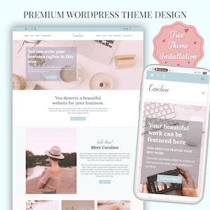 May include: A website design displayed on a laptop and a smartphone. The website features a light blue and white color scheme with the text "Caroline" and "You deserve a beautiful website for your business." A pink heart-shaped sticker says "Free Theme Installation."