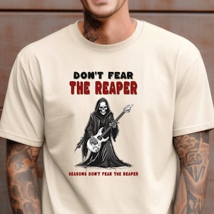 Don&#39;t Fear The Reaper classic rock tshirt salutes the legacy of Blue Oyster Cult. Turn heads with this custom designed rock & roll shirt.