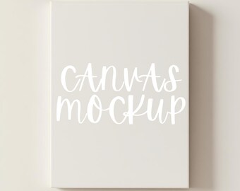 Könnte beinhalten: Rechteckiger Leinwand-Mockup in neutraler Farbe, mit den Worten "CANVAS MOCKUP" in weißer Schrift. Die Leinwand ist zentriert und scheint eine leere Oberfläche zu sein, ideal für die Präsentation von Kunstwerken oder Designs.