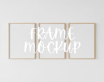May include: Three rectangular picture frames with light wood-colored borders are displayed against a white background. The text "FRAME MOCKUP" is written in a cursive font across the frames.