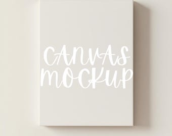 Könnte beinhalten: Ein rechteckiger Leinwand-Mockup in einer neutralen Farbe, mit den Worten "CANVAS MOCKUP" in weißer Schrift. Die Leinwand ist vor einem passenden Hintergrund zentriert, was eine saubere und minimalistische Ästhetik schafft.
