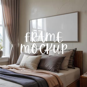 May include: A bedroom scene featuring a bed with multiple pillows and a large framed blank canvas on the wall. The text "FRAME MOCKUP" is overlaid on the image. The bed is made with a variety of pillows and blankets.