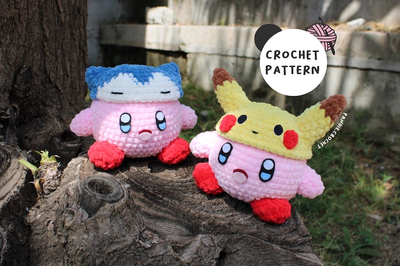 May include: Two crochet plush toys, one resembling Kirby wearing a Snorlax hat and the other Kirby wearing a Pikachu hat. The toys are pink, red, blue, and yellow. The image includes a circular graphic with the words "CROCHET PATTERN".